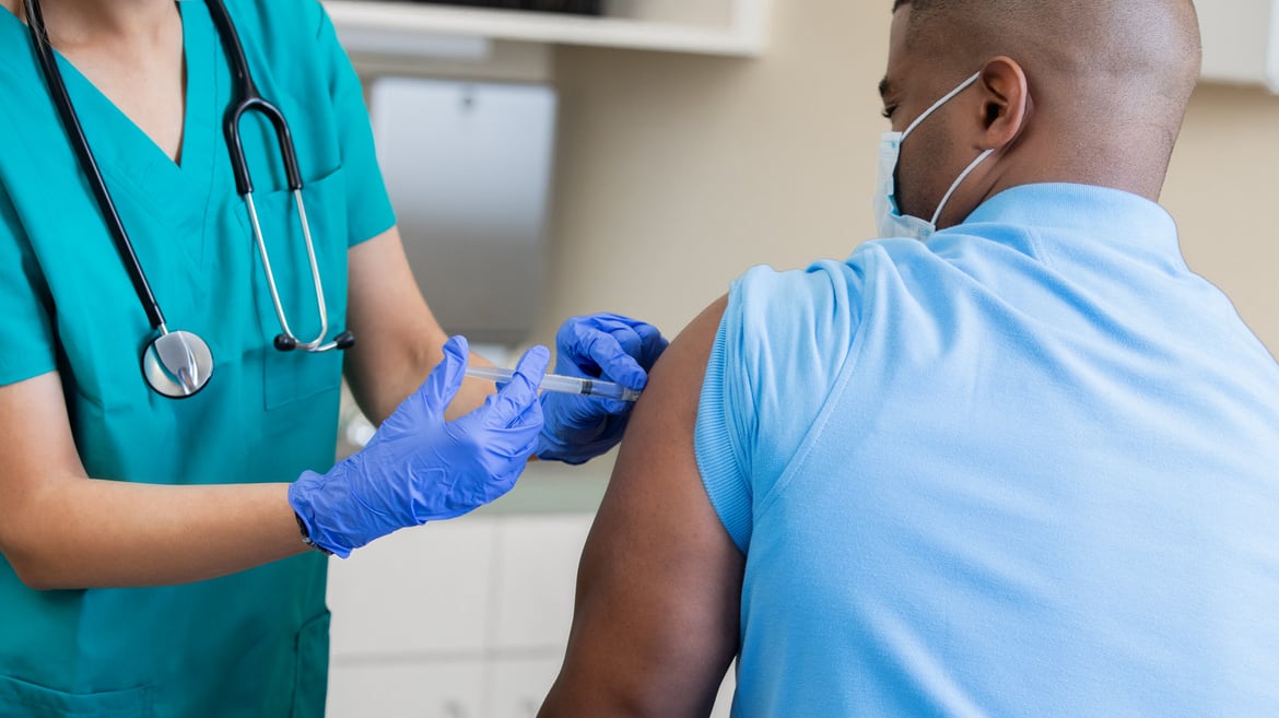 A nurse is giving a patient a vaccine.