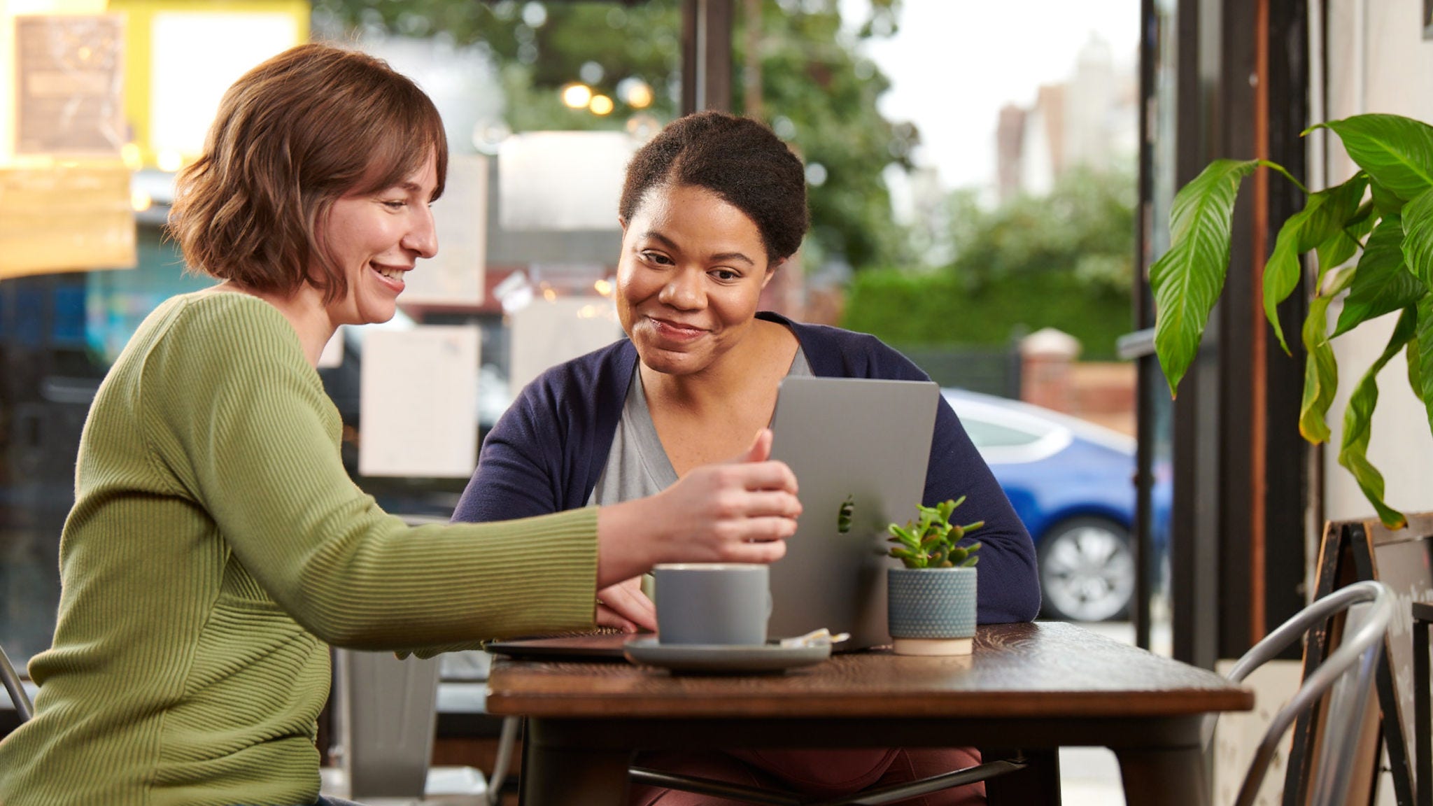 Women working on laptop in cafe