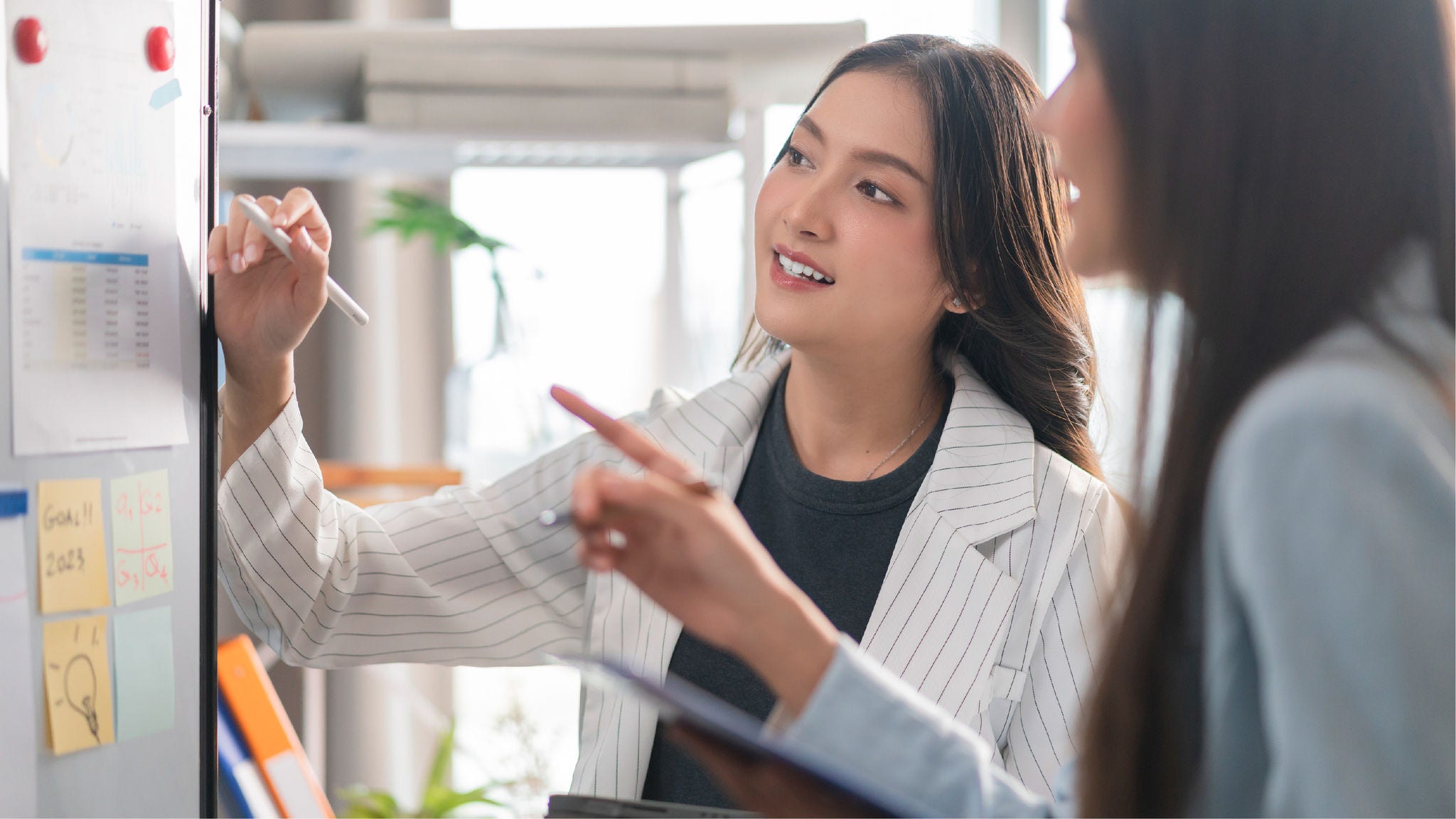 Instructor explains to executive the reasoning behind something.