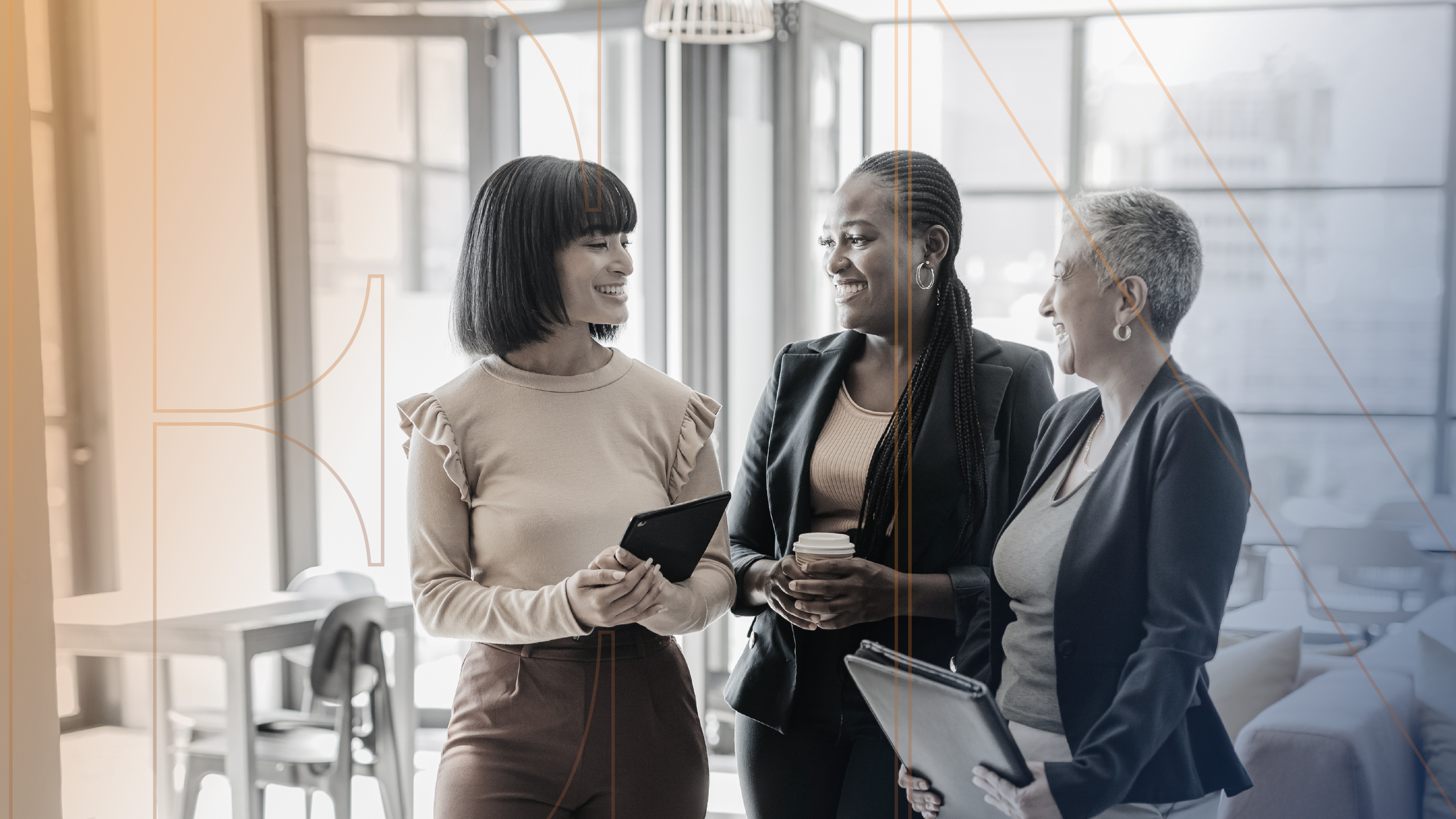 women colleagues smiling and having a discussion