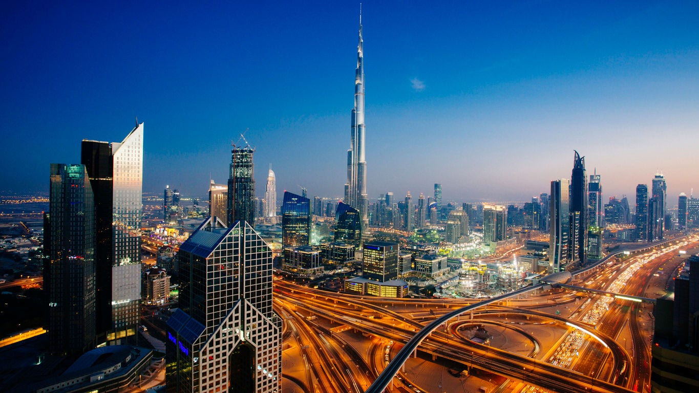 469692894 Dusk view of awesome Dubai's sky line, Aerial view of the city at blue hour.