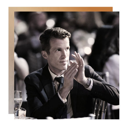 Business man clapping at conference