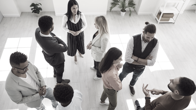 Executives congregating and chatting at a conference