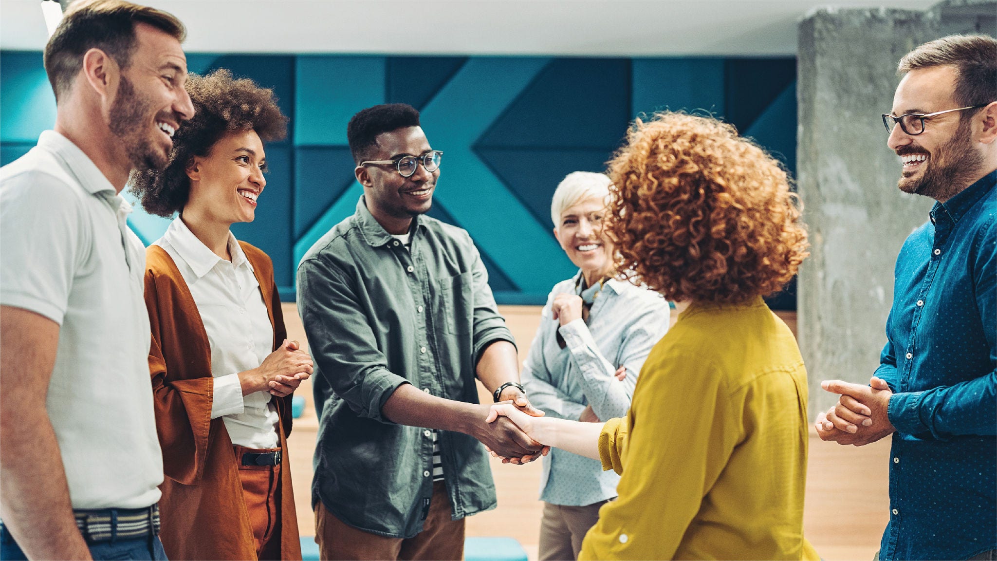 a group of people shaking hands