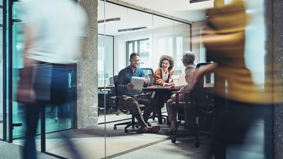 Team meets in a conference room to review project