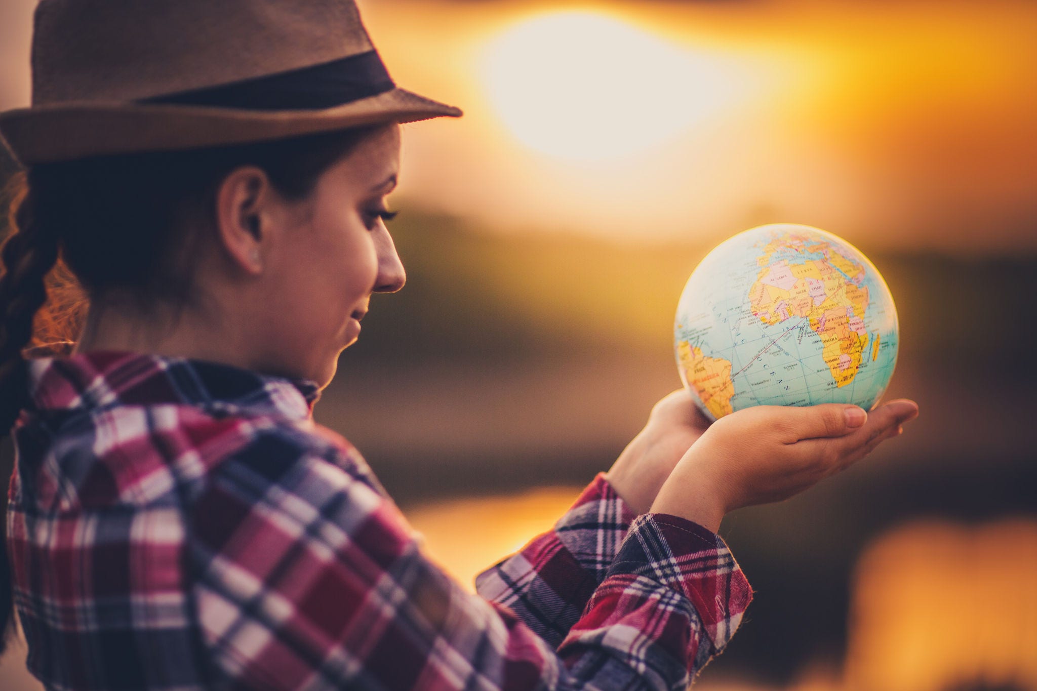 Girl Holding Globe