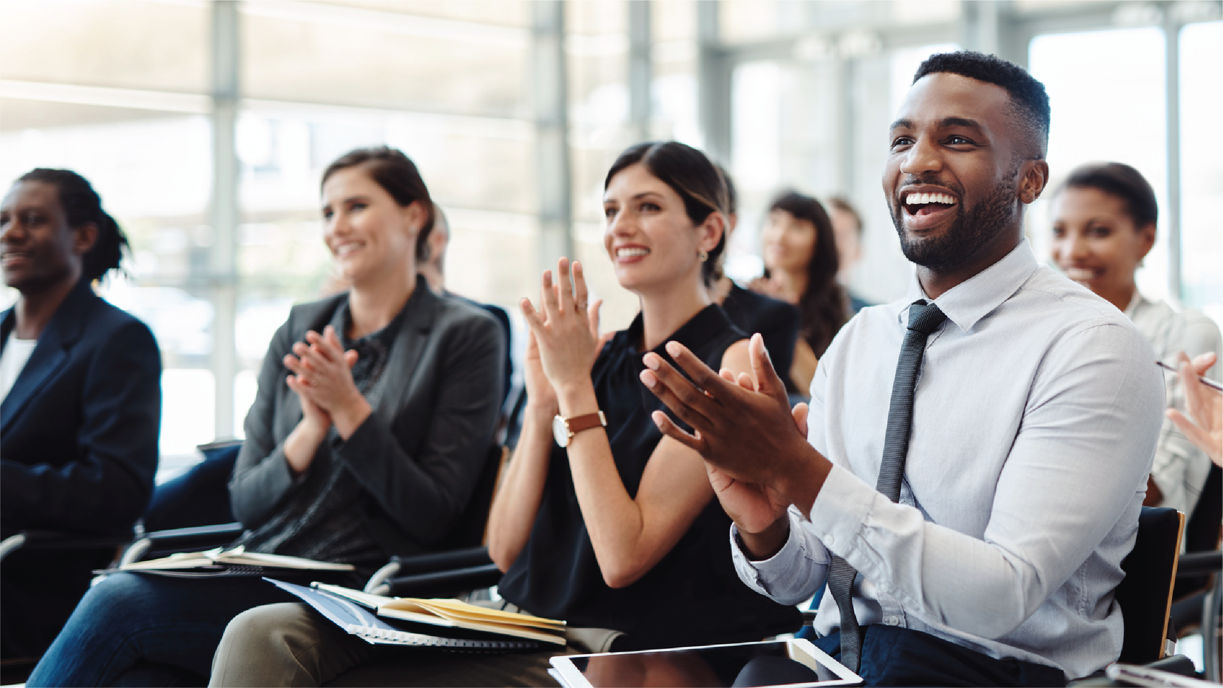 Employees clapping during meeting/session