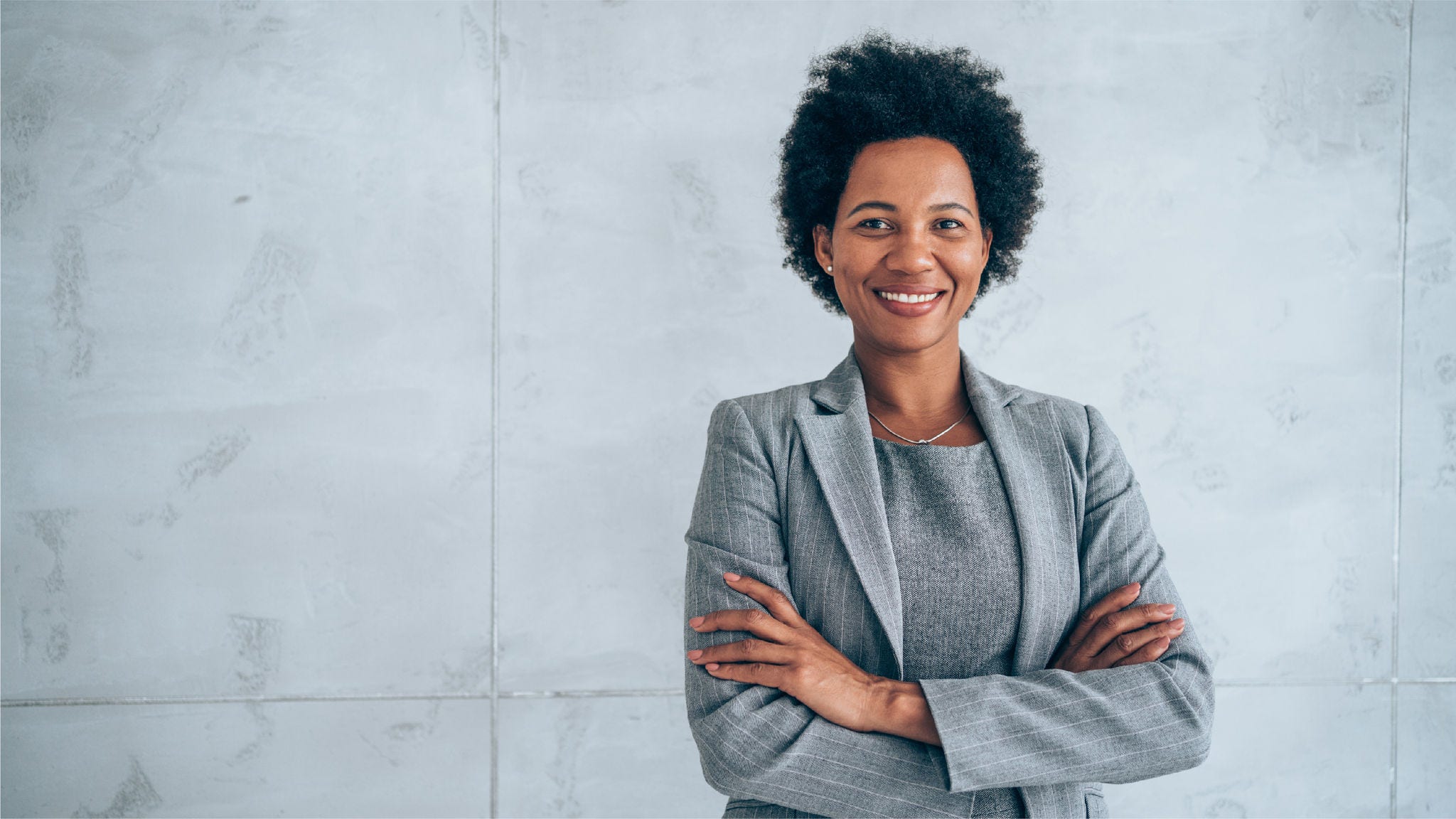 businesswoman standing with her arms crossed