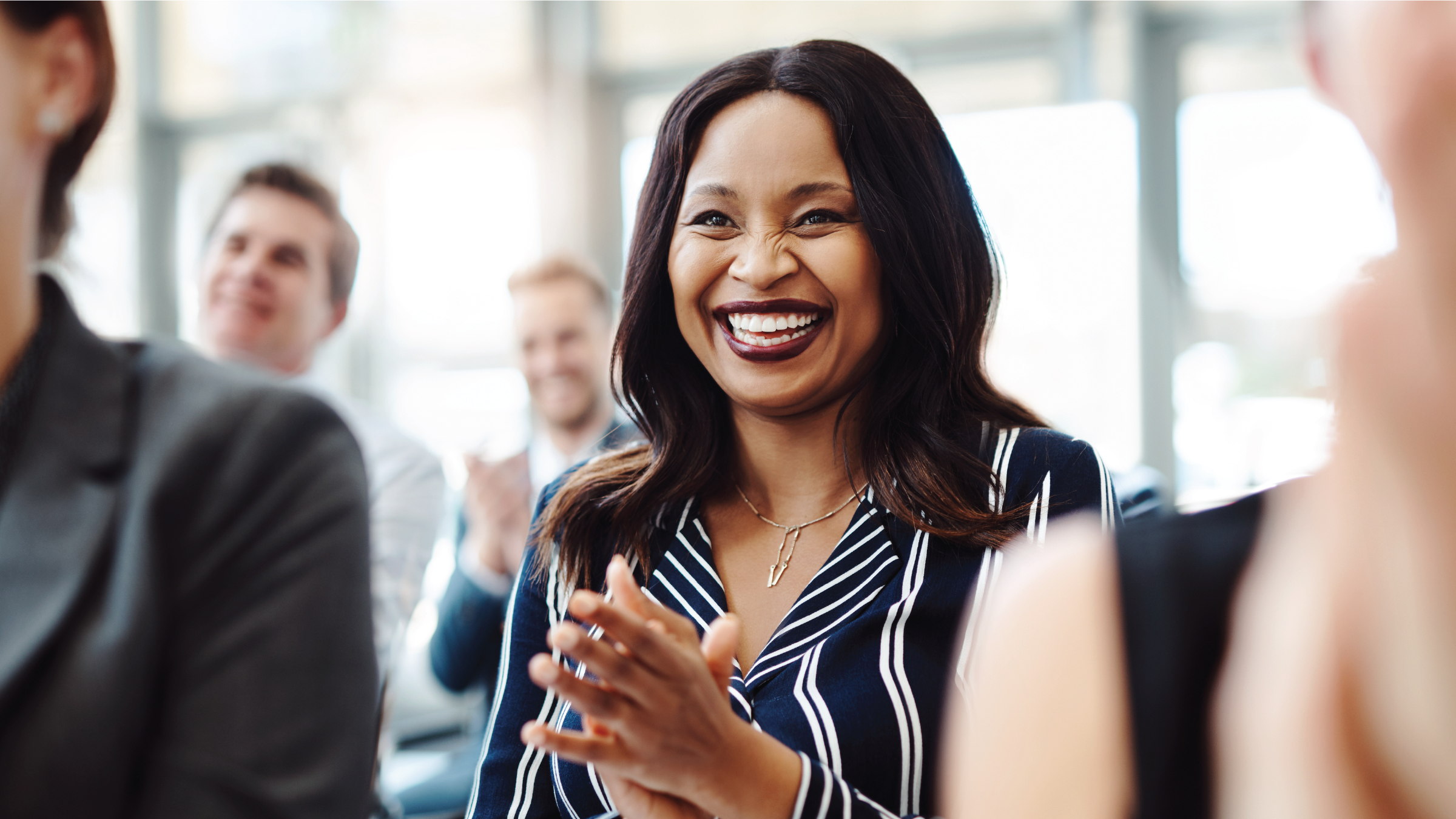 Woman laughing and clapping her hands Woman laughing and clapping her hands