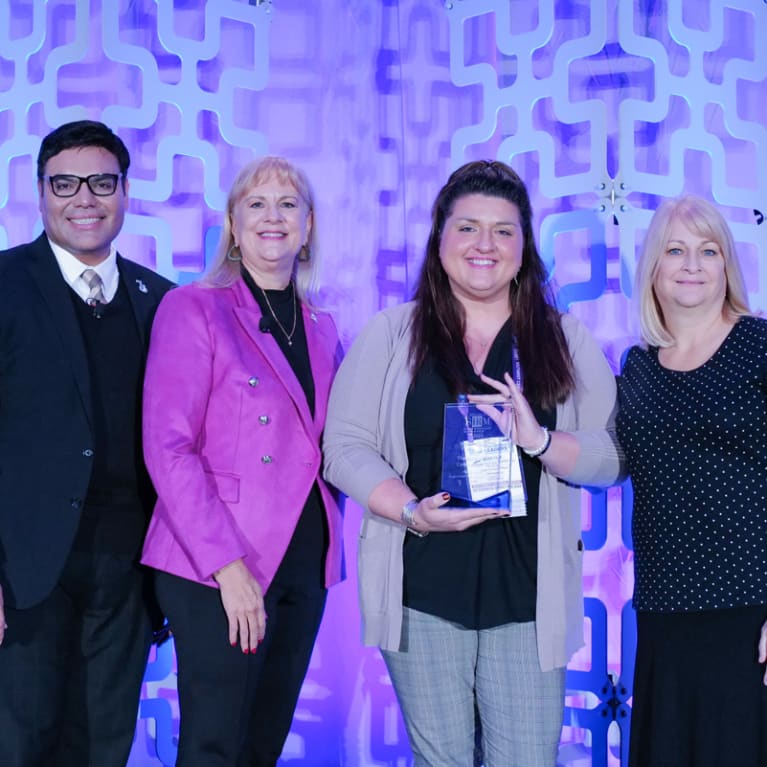 SHRM staff presents the crystal Impact Award to Kansas State Council