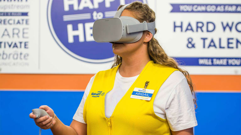 A Walmart employee uses virtual reality (VR) technology in a corporate upskilling training program.