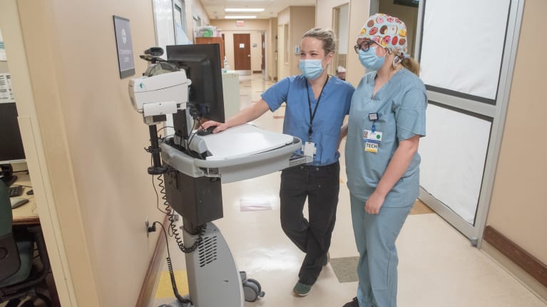 During the onset of the pandemic, employees at  Henry Ford Health System were cross-trained to help ease the burden on nurses an