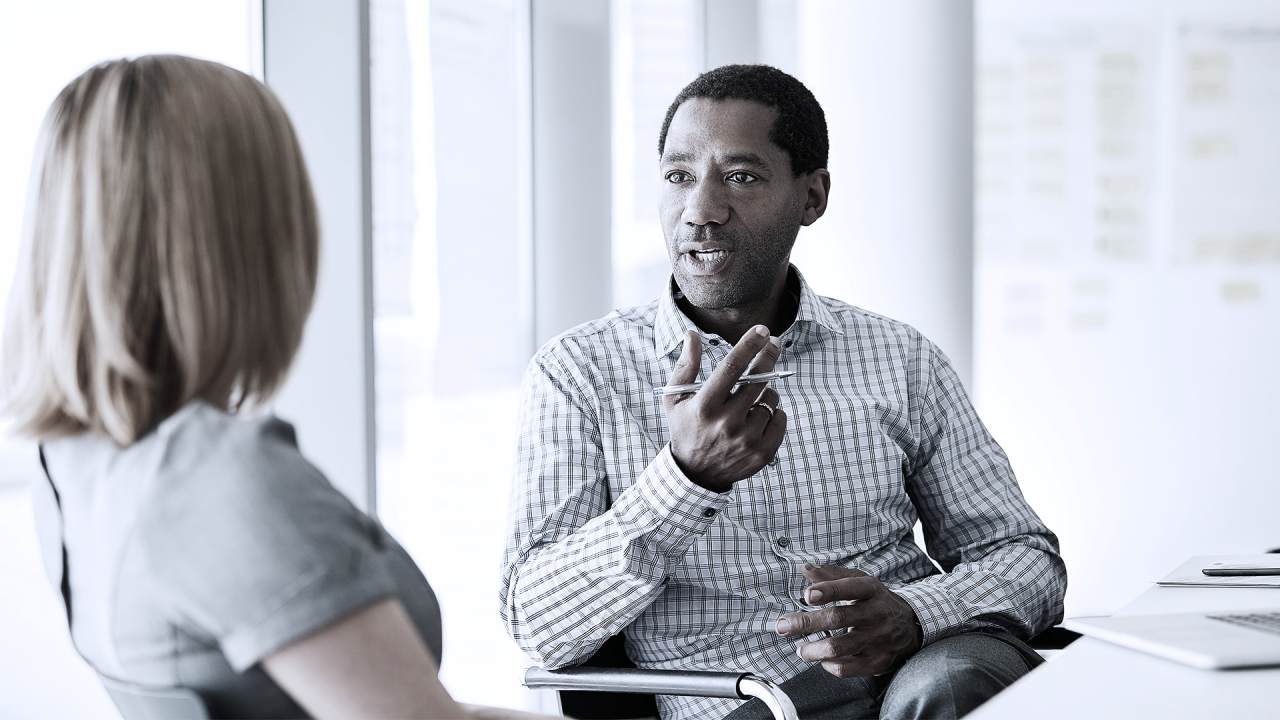 Male executive talking to manager