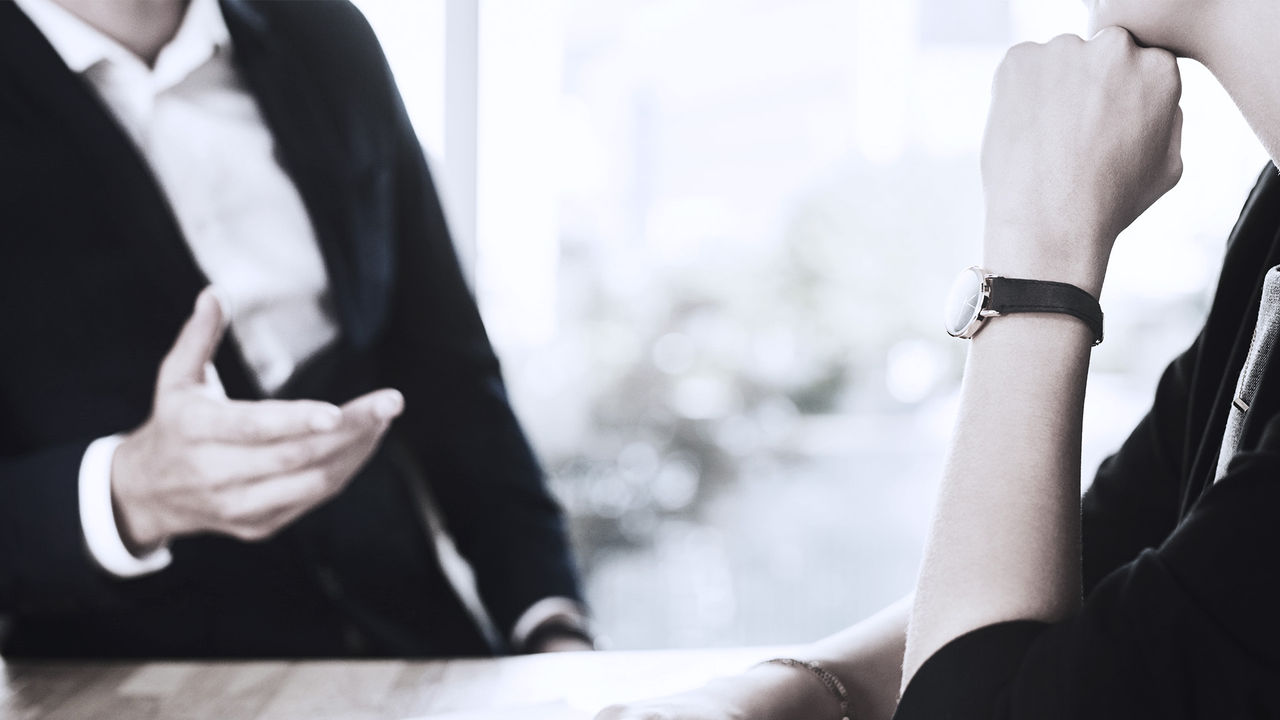 Two business executives in a coaching conversation