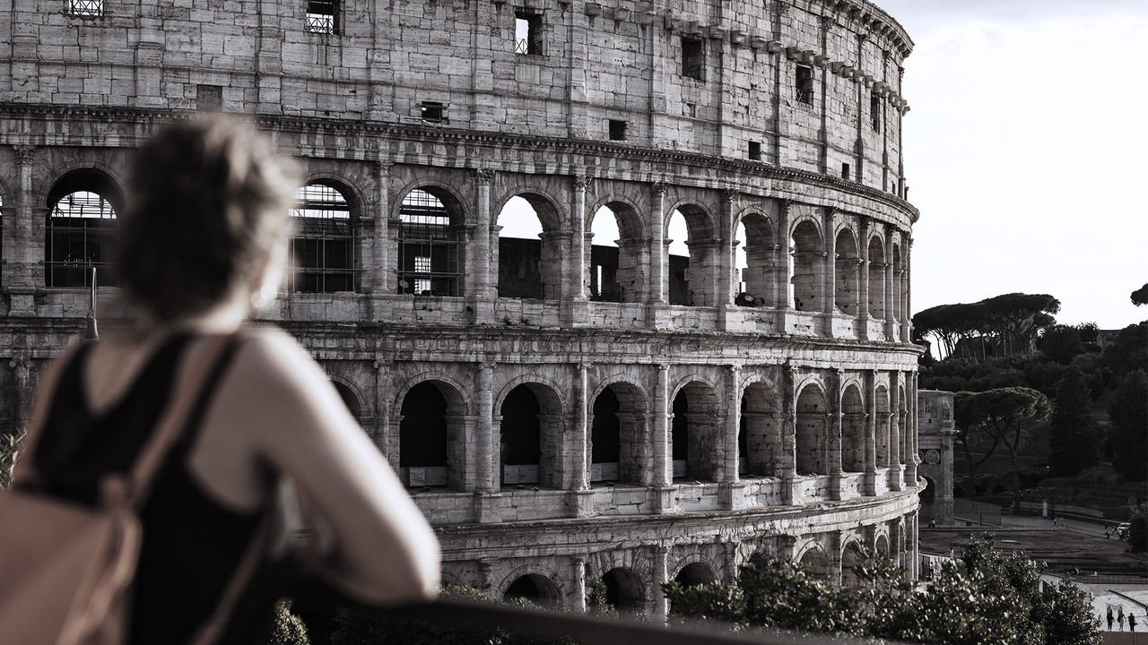 woman looking at the Roman Colleseum