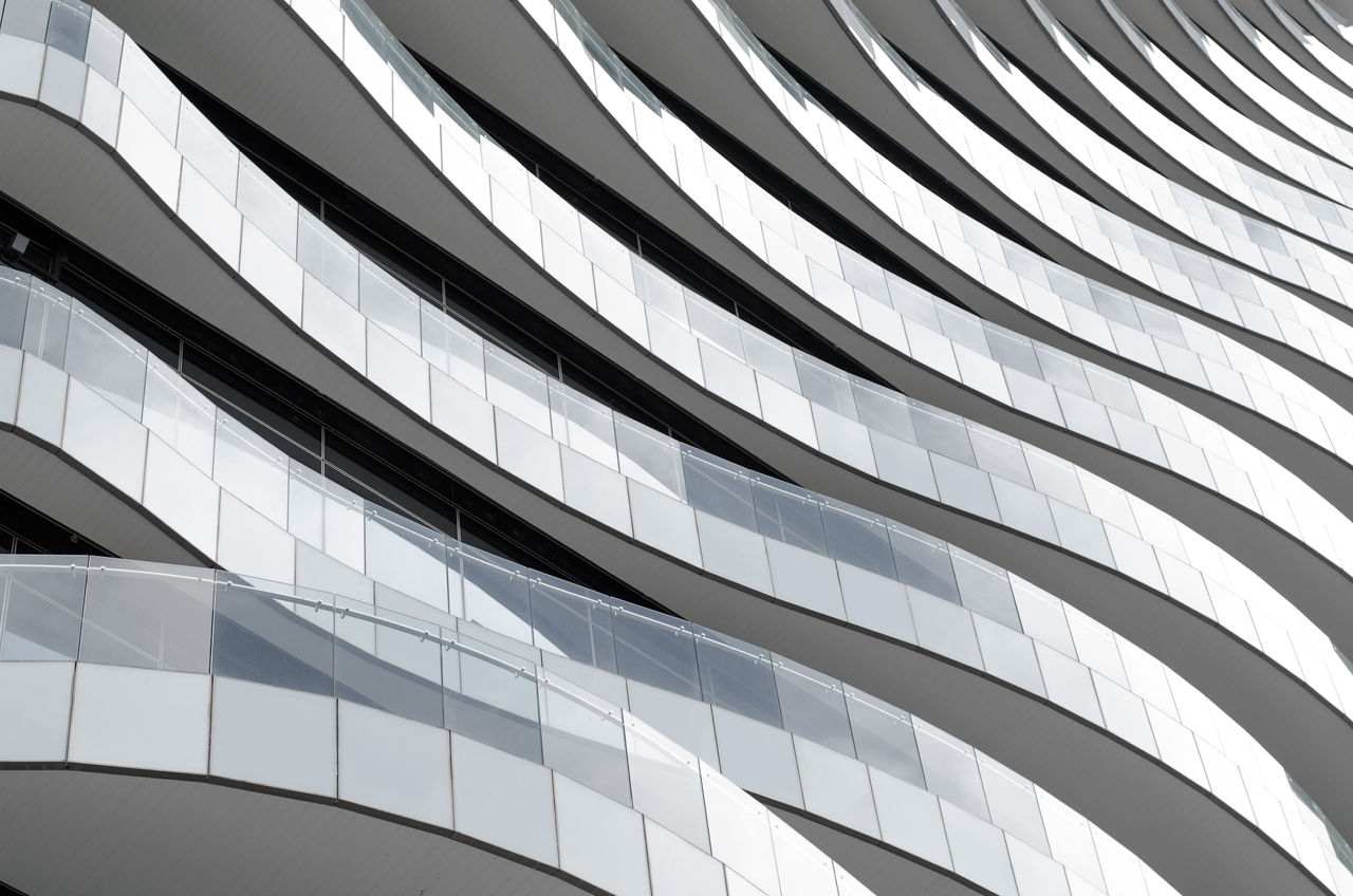 505975325 A stack of curved balconies jutting out from a building.