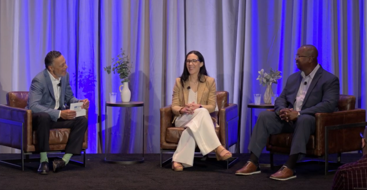 On stage at SHRM26, host Mo Fathelbad is seated on the left, guest Carmen Barboza is seated in the center, and guest Albert Smothers is seated on the right.