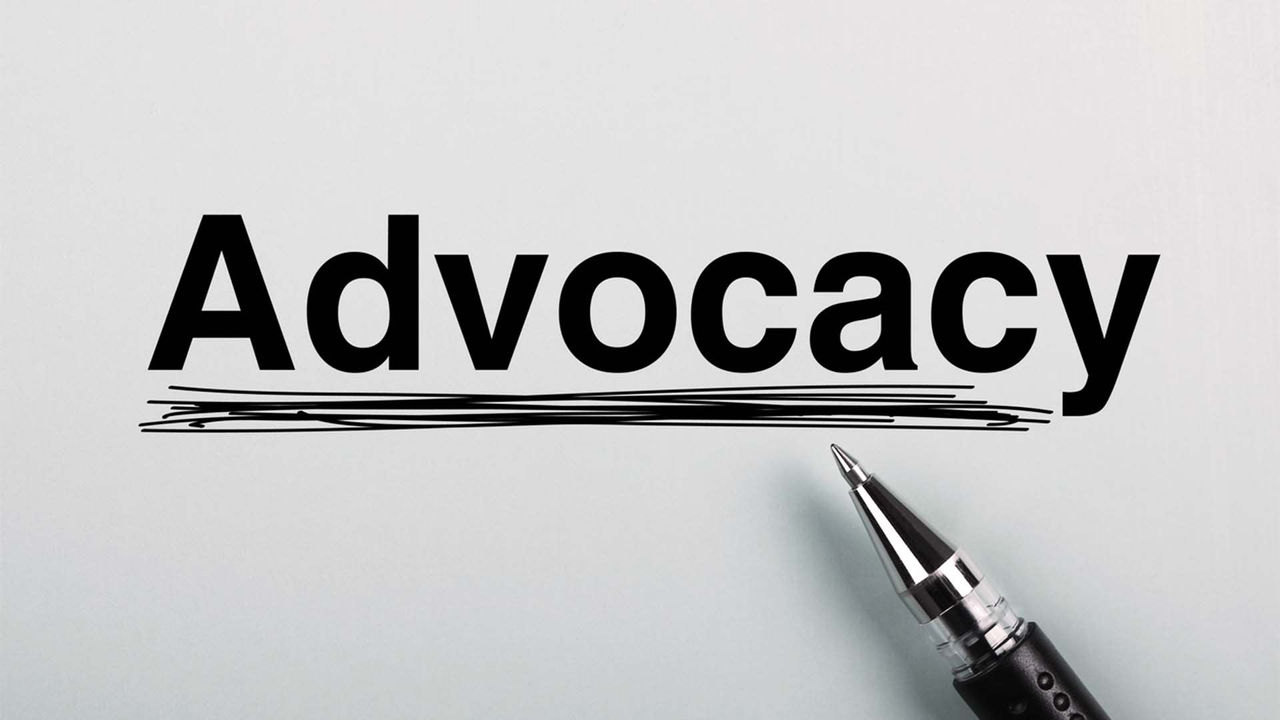 The word advocacy is written on a piece of paper.