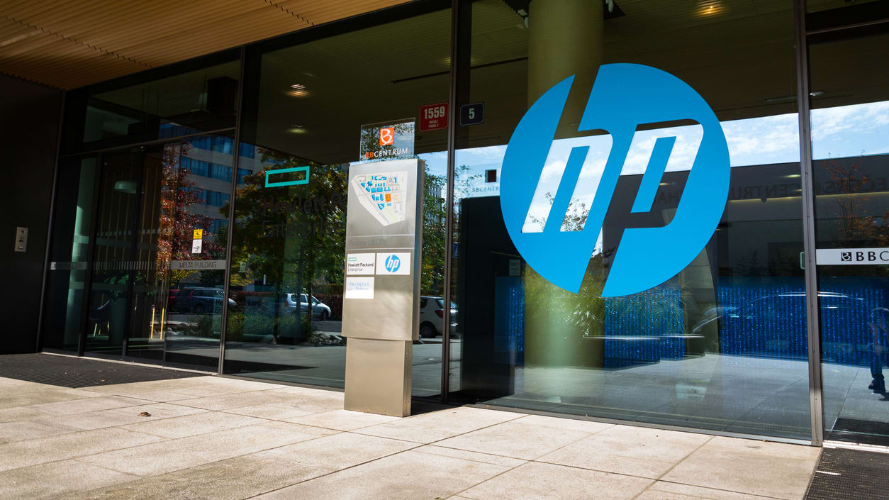 Hp logo in front of a glass door.