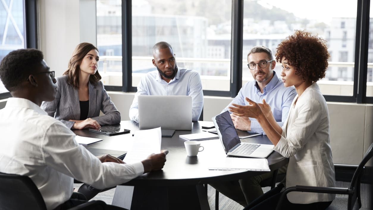 A group of business people having a meeting in a conference room.