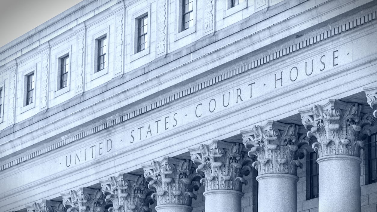 A black and white photo of the united states court house.