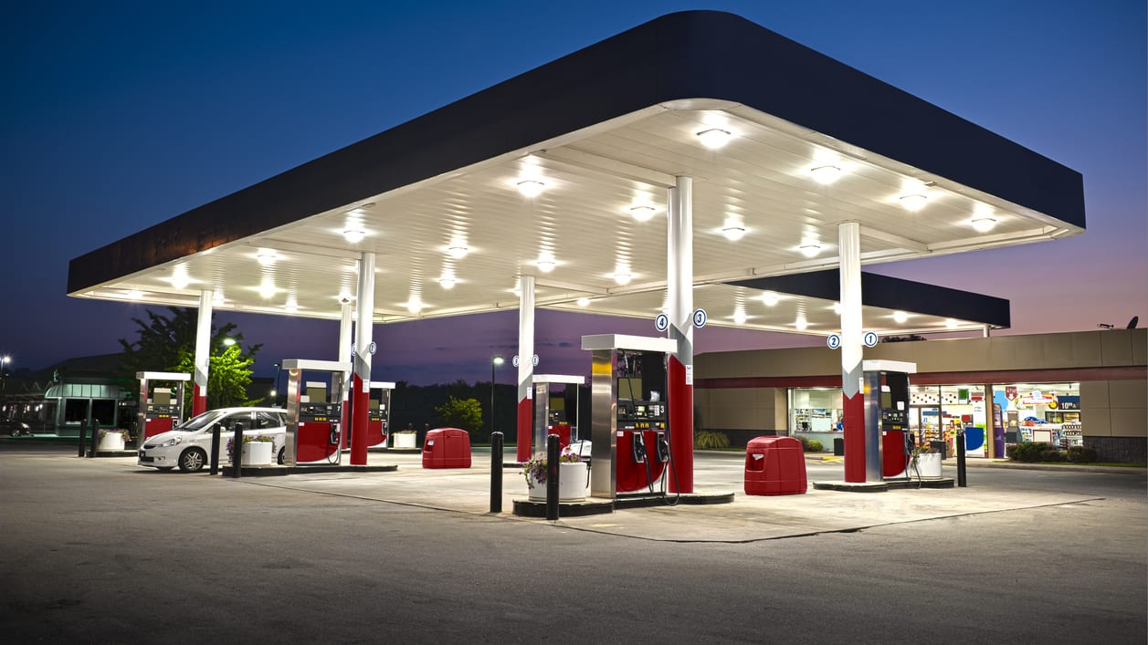 An image of a gas station at night.