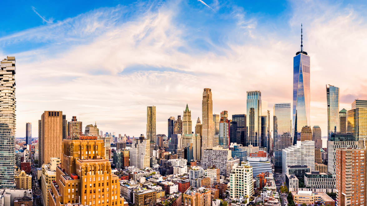 The skyline of new york city at sunset.