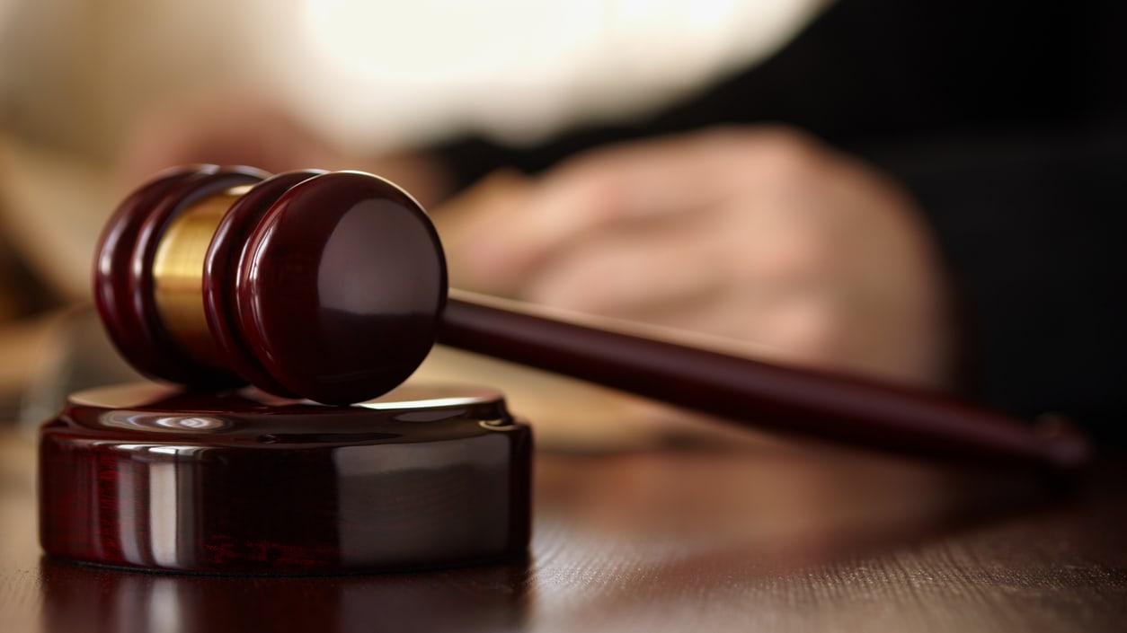 A judge's gavel sitting on a table.