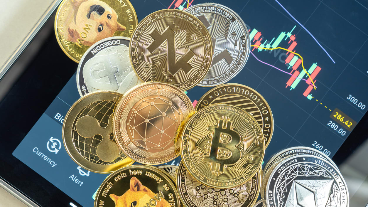 A tablet with a bunch of cryptocurrencies on it.