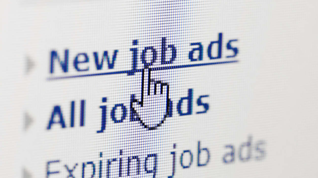 A computer screen shows a new job ad.