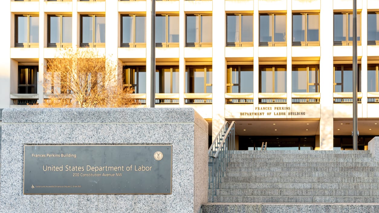 A building with a sign in front of it.