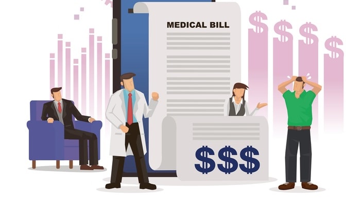 A group of people standing around a medical bill.