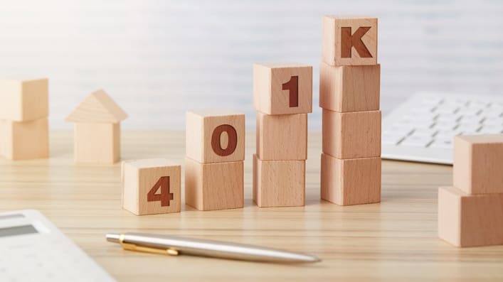 A stack of wooden blocks with the word 401k written on them.