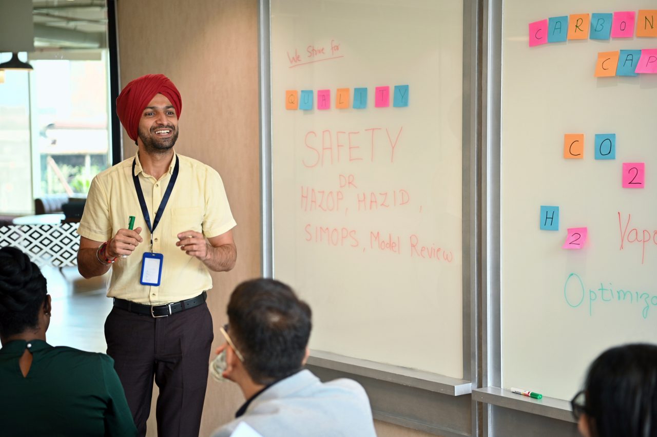 a trainer speaking in front of employees
