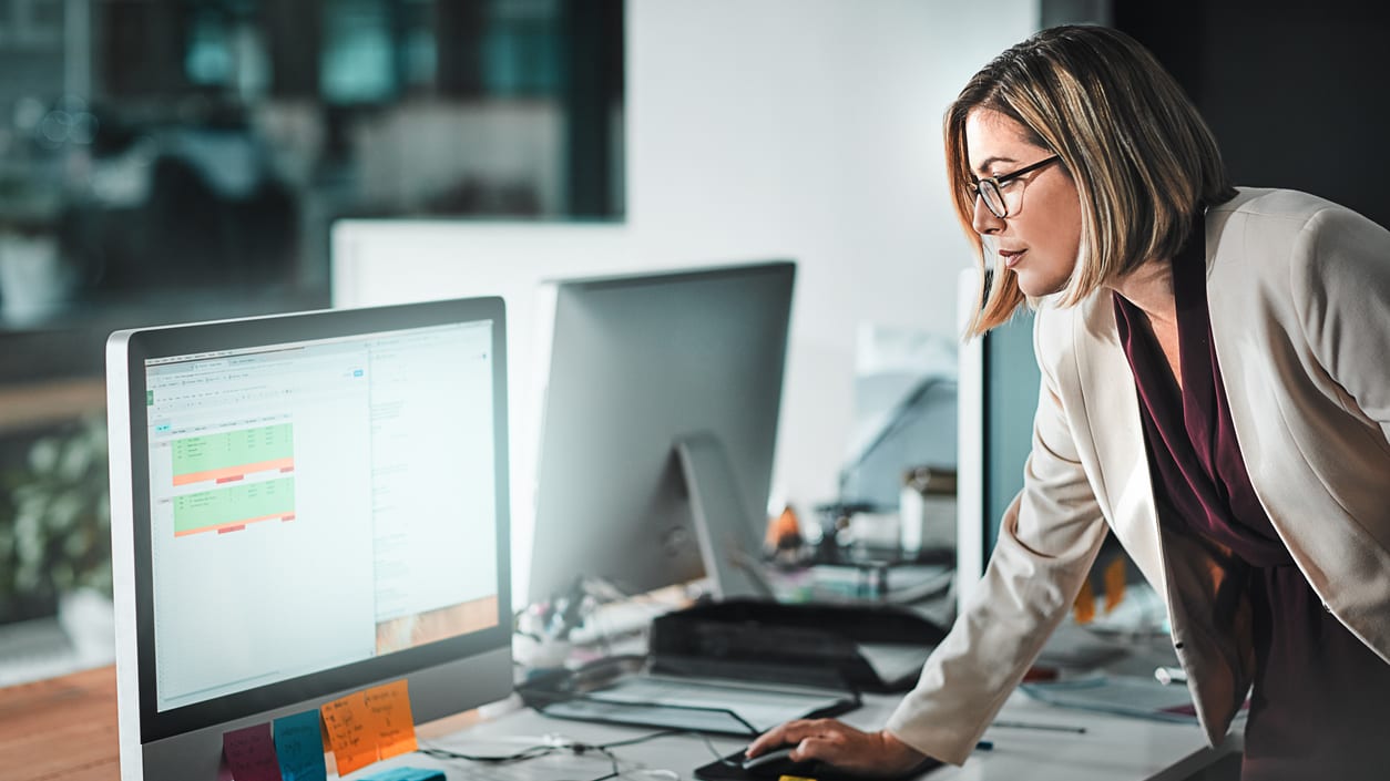 A woman looking at a computer screen.