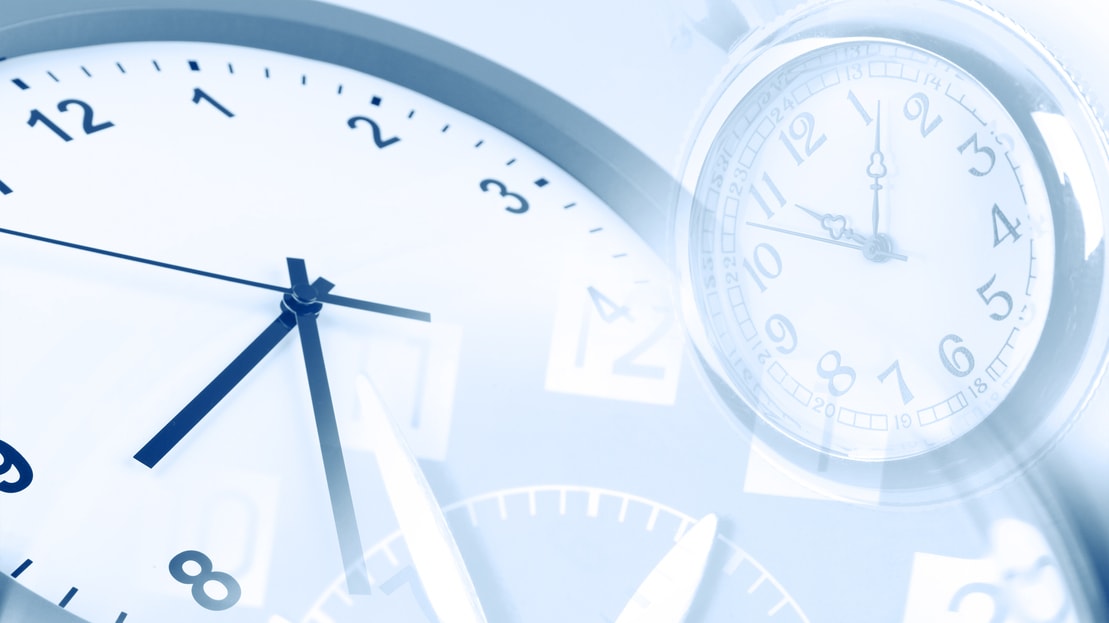 A group of clocks on a blue background.