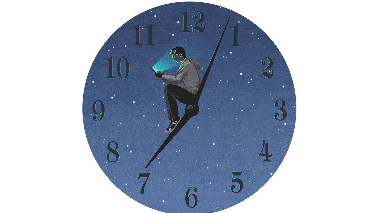 A clock with a man sitting on it.