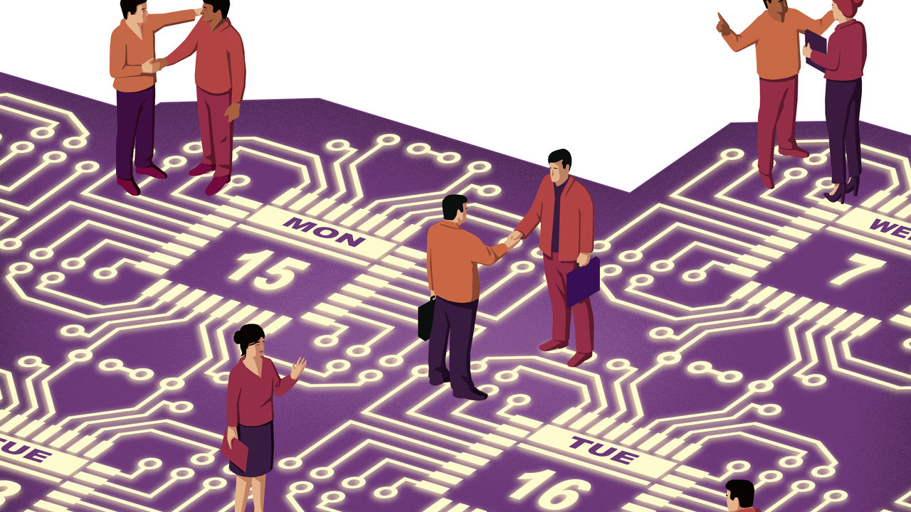 A group of people standing on a purple circuit board.