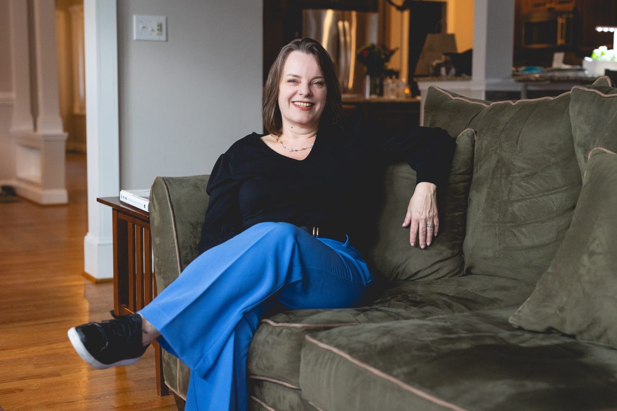 Maggie Ruvoldt relaxes on her couch