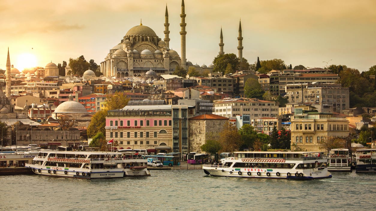 A view of a city with boats on the water.