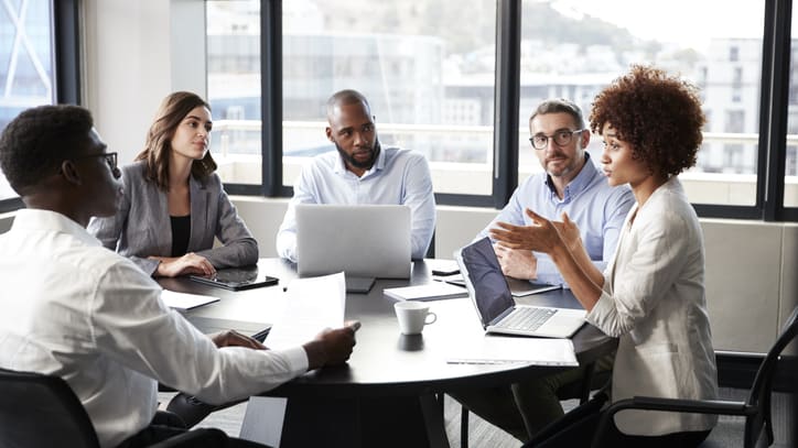 A group of business people having a meeting in a conference room.