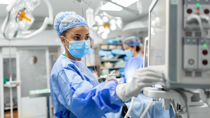 A group of surgeons working in an operating room.