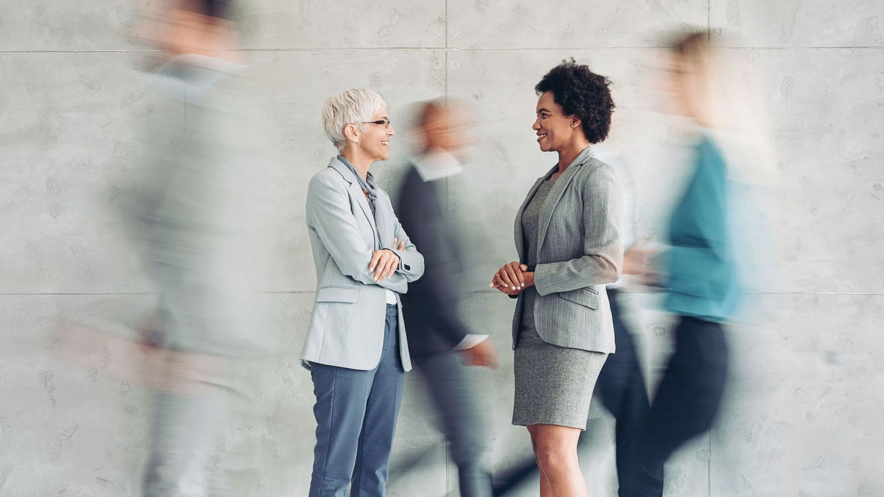 women talking in office