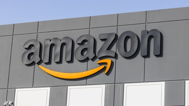 The amazon logo is seen on the side of a building.