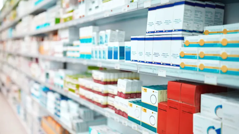 medications on a shelf at a pharmacy
