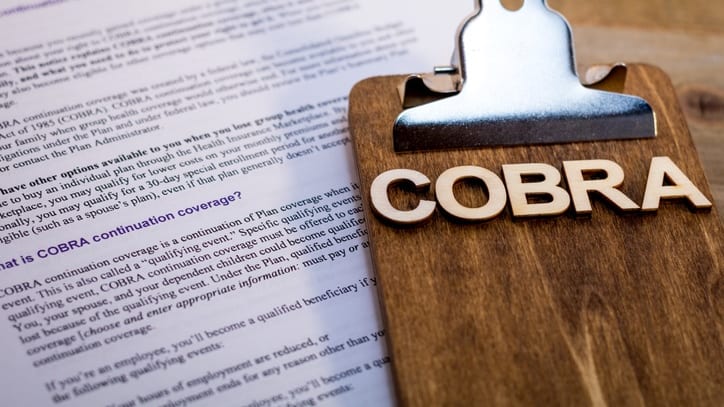 A clipboard with the word cobra on it.