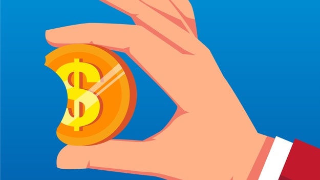 A hand holding a dollar coin on a blue background.