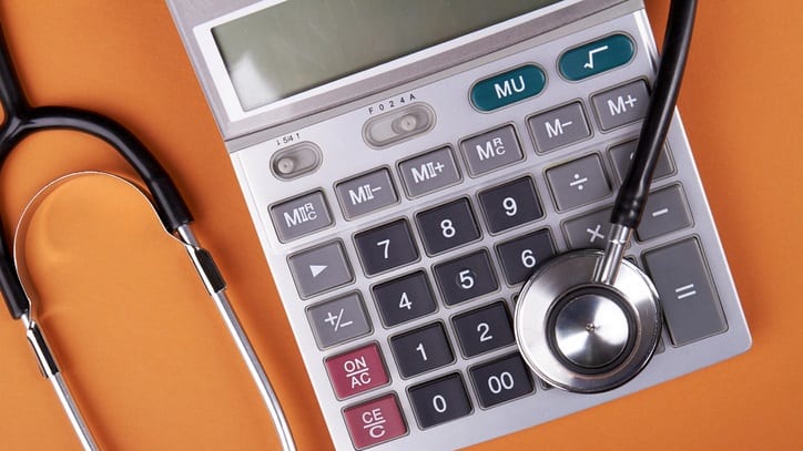 A calculator with a stethoscope on it.