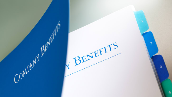 A blue folder with the word company benefits on it.