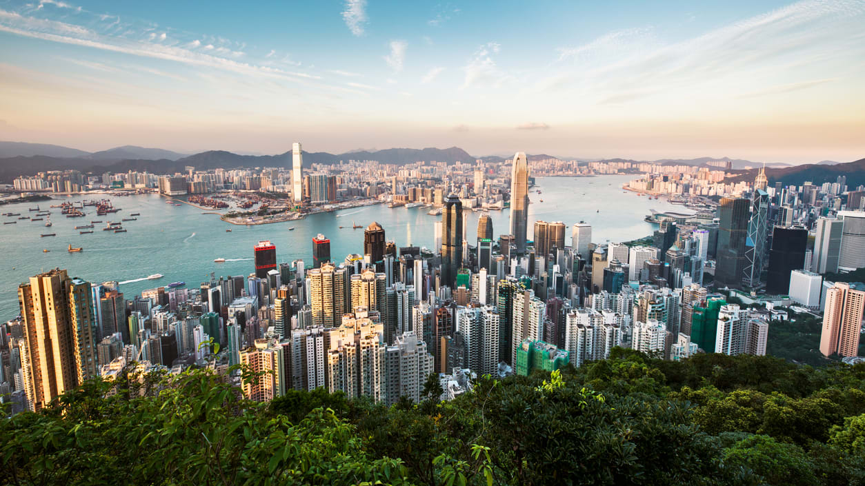 The skyline of hong kong at sunset.